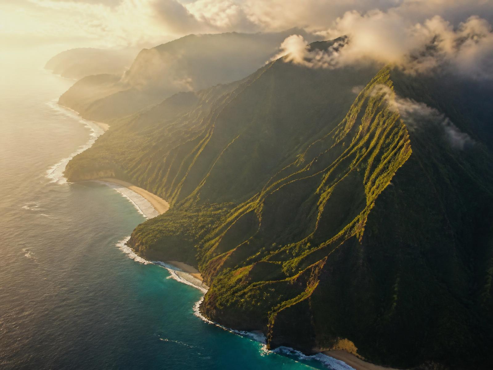 Aerial view of a tropical coastline at golden hour